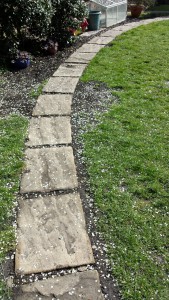 Garden path designed to gently curve through the rear garden to provide access to a shed